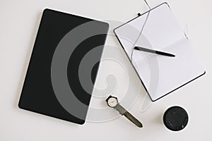 Workspace background with laptop, coffee, pen and notebook. Working, business, freelance concept. Copyspace, top view, flatlay