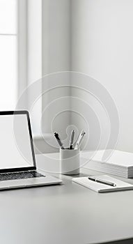 Minimalist Workspace with Laptop and Stationery