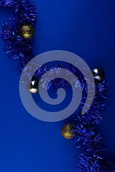 Minimalistic conceptual Christmas or New Year Christmas flatley on a dark blue background with Christmas toys