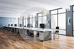 Minimalistic office interior room with computers and wooden floor