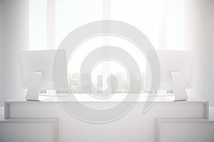 Minimalistic reception desk with computers