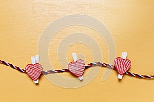 Minimalistic simple Valentine`s day card, little red hearts on beige