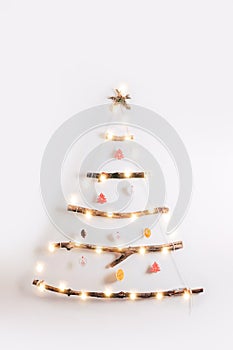 Minimalistic style Christmas tree on white background.