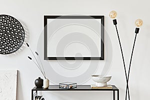 Minimalistic stylish composition of creative room interior design with mock up poster frame, metal shelf, industrial lamp.