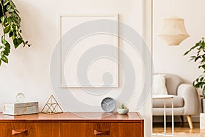 Minimalistic and stylish mock up poster frame concept with retro furnitures, hanging plant, decoration.