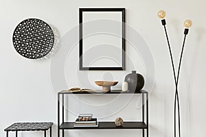 Minimalistic stylish room interior design with mock up poster frame, metal shelf, industrial lamp and personal accessories. Black.