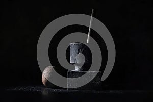 Minimalistic tenebrism art with geometric forms in dark setting