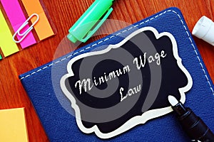 Minimum Wage Law phrase on the piece of paper