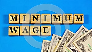 The minimum wage. The text inscription on the cubes.