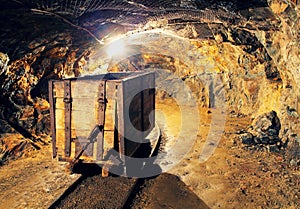 Mining cart in silver, gold, copper mine photo