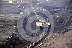 Mining, a conveyor system for transporting rock mass to the surface.