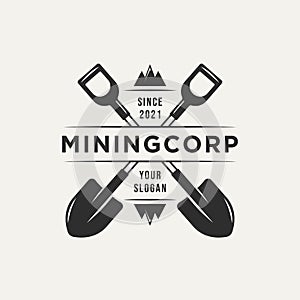 Mining corp and two crossed shovel vintage logo photo