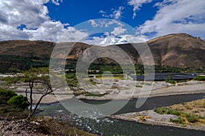 mining debris in the santa river in callejon de huaylas with snowy mountain