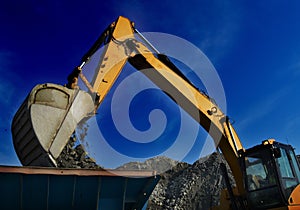 Mining digger moving rock photo