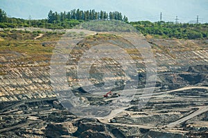 Mining dump trucks working in coalmine.