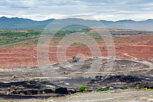 Mining dump trucks working in Lignite coalmine