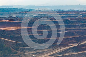 Mining dump trucks working in Lignite coalmine lampang thailand