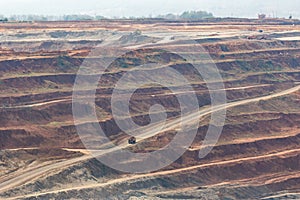 Mining dump trucks working in Lignite coalmine lampang thailand