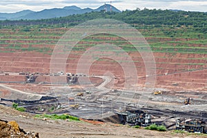 Mining dump trucks working in Lignite coalmine