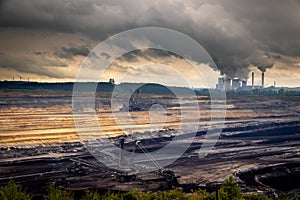 Mining equipment in a brown coal open-pit mine and a power plant with emission