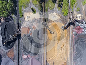 Mining excavator on the bottom surface mine. Brown coal deposits