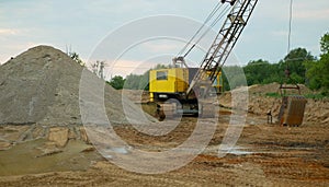 Mining gravel sand pit excavator digger dredger extraction machine colliery output quarry building gray pile mine surface grit