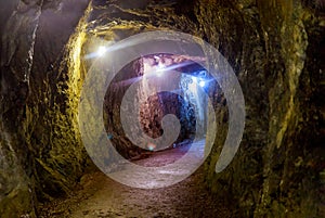 Mining industry underground mine tunnel with lights