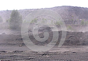 Mining KAMAZ works in a stone quarry produces coal through the dust