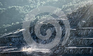 Mining machines working in diabase quarry