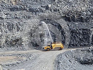 Mining water cart wetting washing walls.