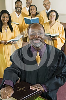 Minister at altar, gospel choir in background