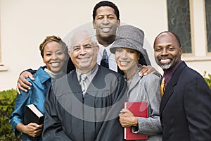 Minister with Family in church garden portrait photo
