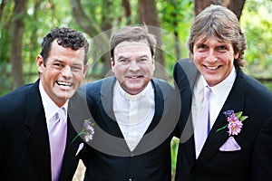 Minister Posing With Gay Wedding Couple photo