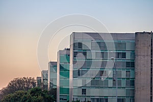 Ministry buildings at Esplanade of the Ministeries at sunset - government departments offices - Brasilia, Distrito Federal, Brazil