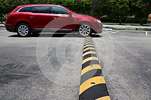 Minivan Driving Over Speed Bump