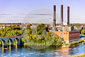 Minneapolis, MN, river and bridge near downtown buildings