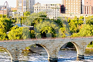 Minneapolis, MN, river and bridge with runner near downtown