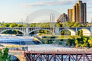 Minneapolis, MN, river and bridge with runner near downtown