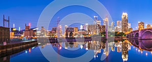 Minneapolis skyline with reflection in river at night photo