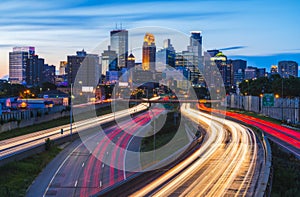 Minneapolis skyline with traffic light at night