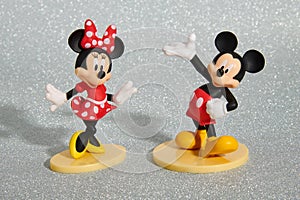 Minnie Mouse and Mickey Mouse dance on round blocks