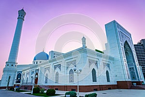 The Minor Mosque covered with white marble in the center of Tashkent at sunset.