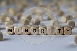 Minority - cube with letters, sign with wooden cubes