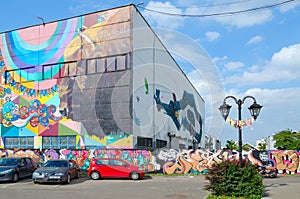 Street art on Oktyabrskaya street. Graffiti on wall of industrial building, created as part of Vulica Brasil festival, Minsk