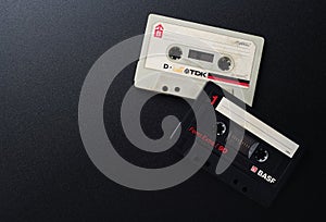 MINSK BELARUS-06/29/2020: Compact cassettes TDK D-C90, BASF Audio on a black background. Old white and black vintage audio cassett