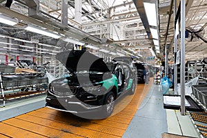 Minsk, Belarus - Dec 15, 2021: Photo of modern car assembly plant. Interior of a high-tech factory of new automobiles