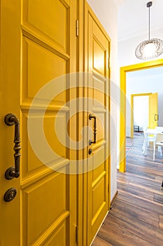 MINSK, BELARUS - March, 2019: retro bright interior of hipster flat apartments with yellow door