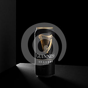 MINSK, BELARUS - OCTOBER 19, 2021: Alluminium can of Guinness original beer on black background. Guinness beer has been produced