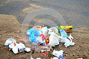 People throw away plastic bottles, bags and food waste, leave trash on the street after themselves.