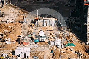 Minsk, Belarus. Special Concrete Transport Truck In-Transit Mixer Unit On City Building Site. Construction Of Houses